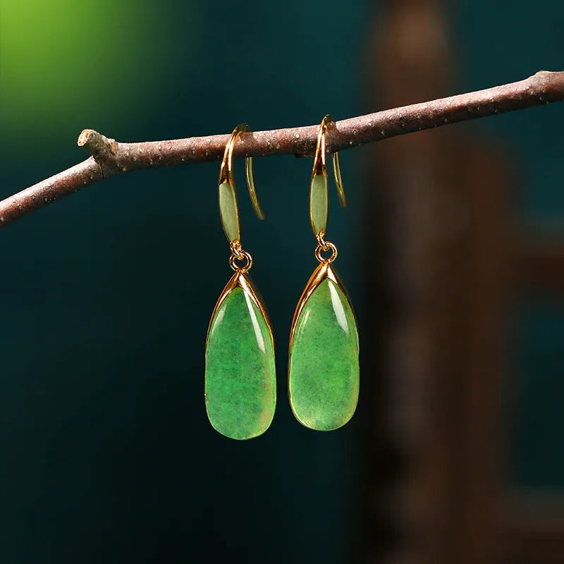 Geometric copper earrings with jade-colour water droplet elements in Chinese banquet style