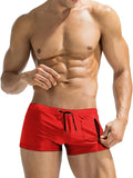 Men's black high-waisted swimming trunks with a white lace-up front detail, laid flat.