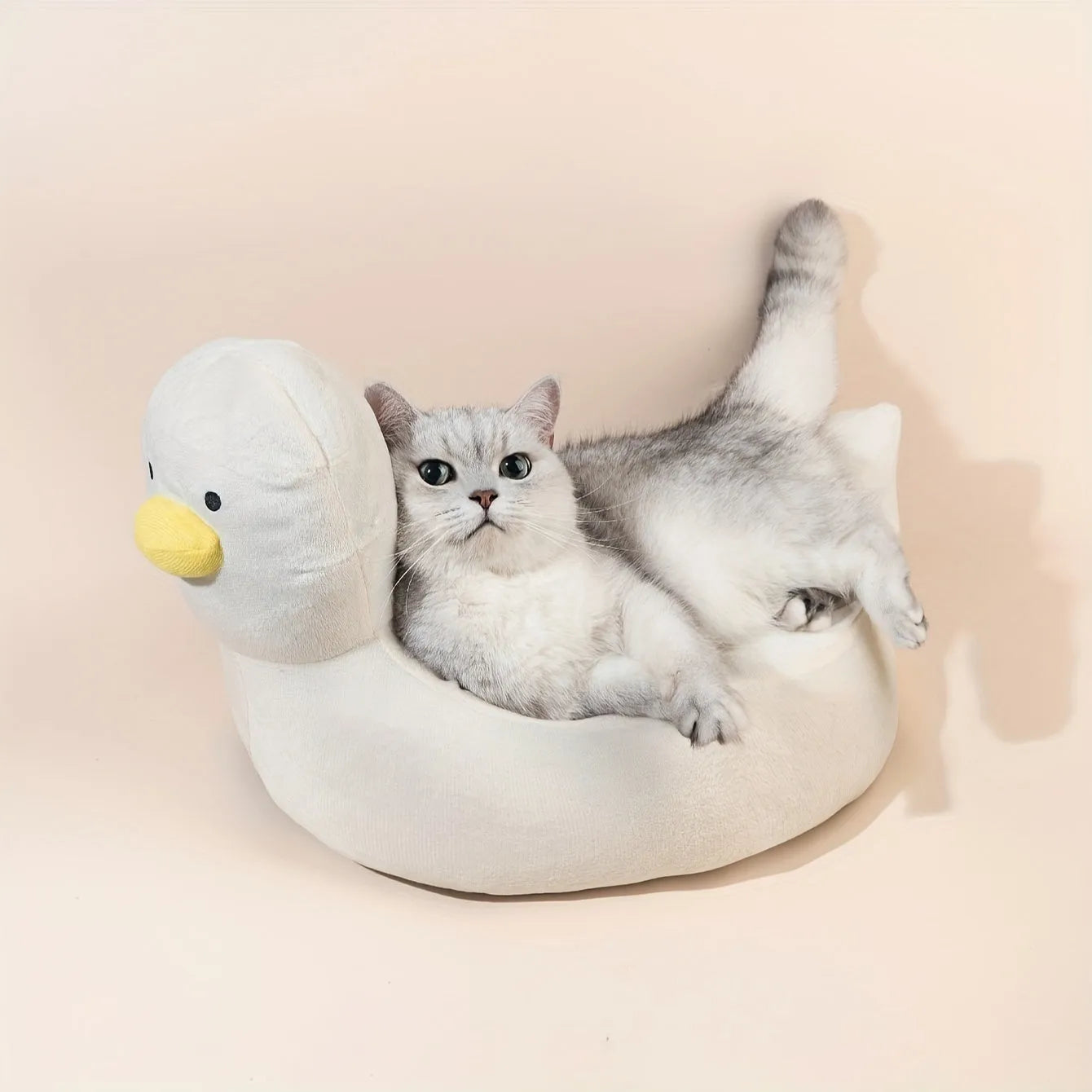 Duck-shaped fluffy pet bed in blue or white colours for small dogs and cats
