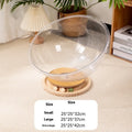 Transparent acrylic cat space capsule bathtub bed with turntable base on wooden floor