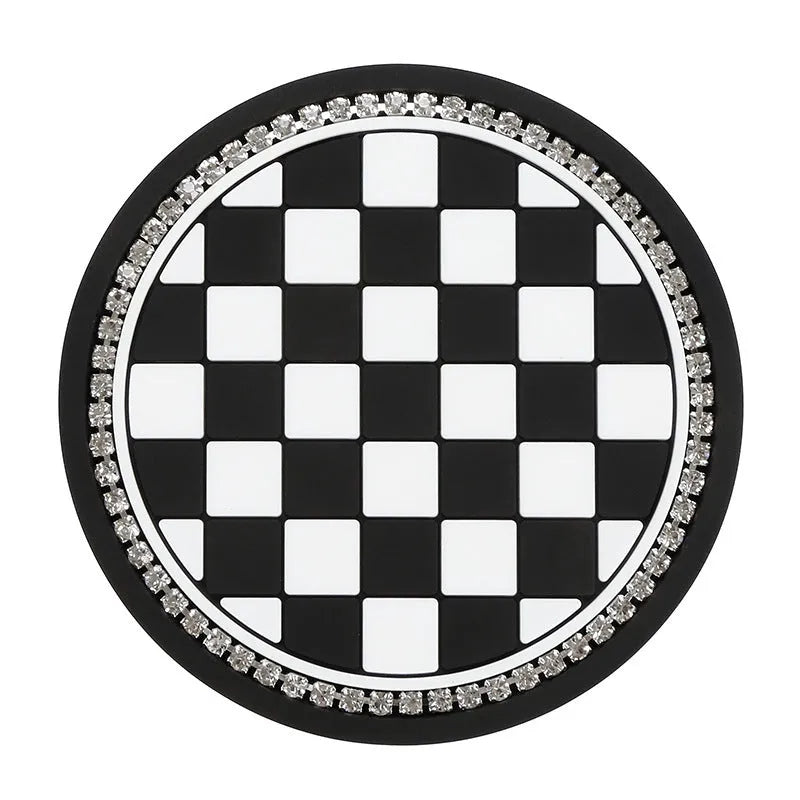 Black and white checkerboard pattern PVC car cup holder mat inserted in a vehicle centre console.