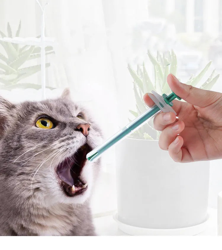 Two soft-tip silica gel pet pill shooters for cats and dogs on a white background