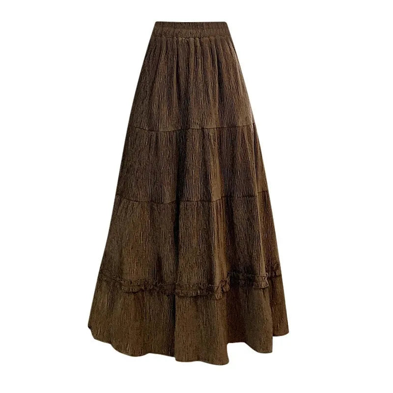 Women's beige corduroy A-line midi skirt with elastic waistband laid flat