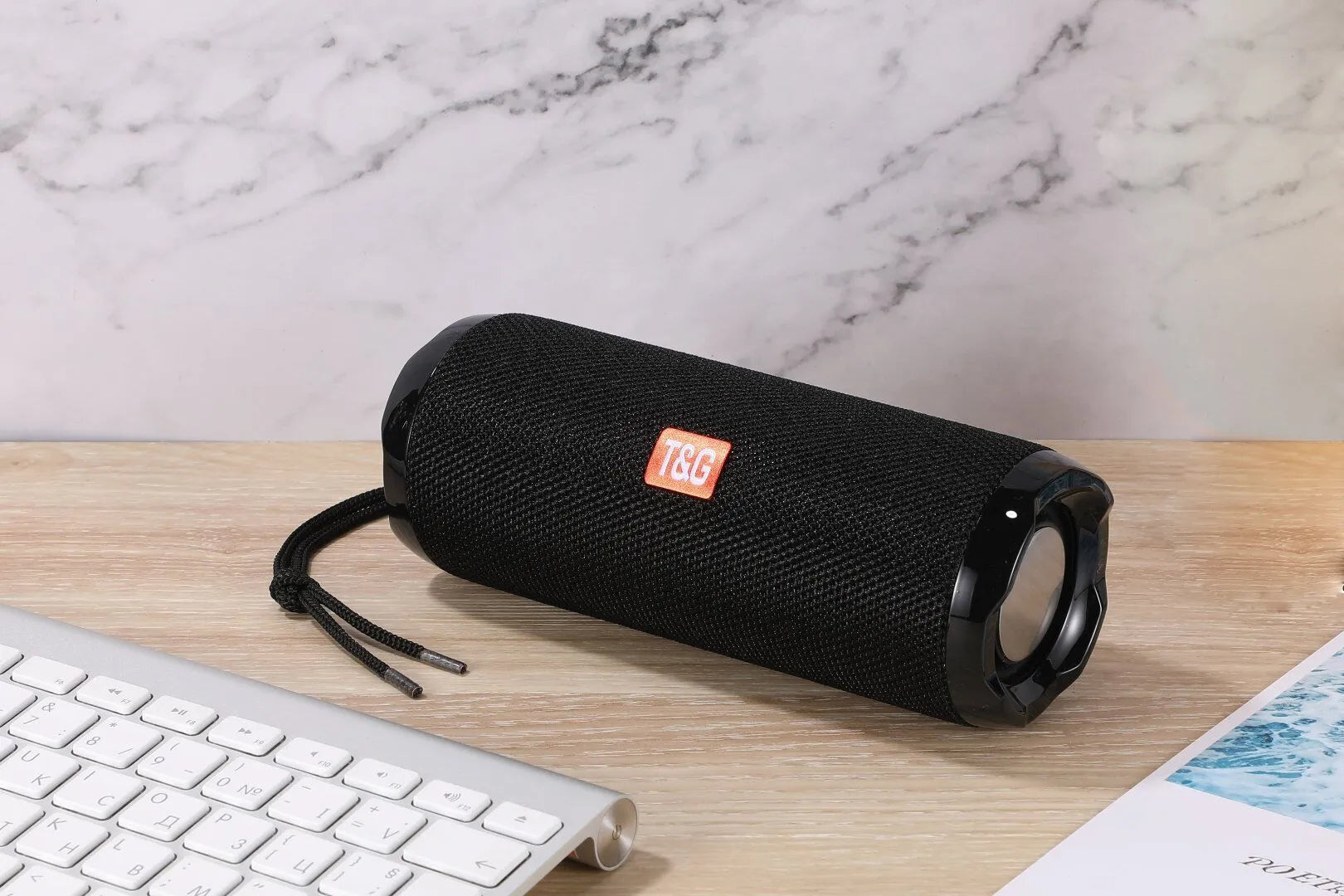 Fabric-covered portable Bluetooth speaker with integrated card holder slot in blue colour