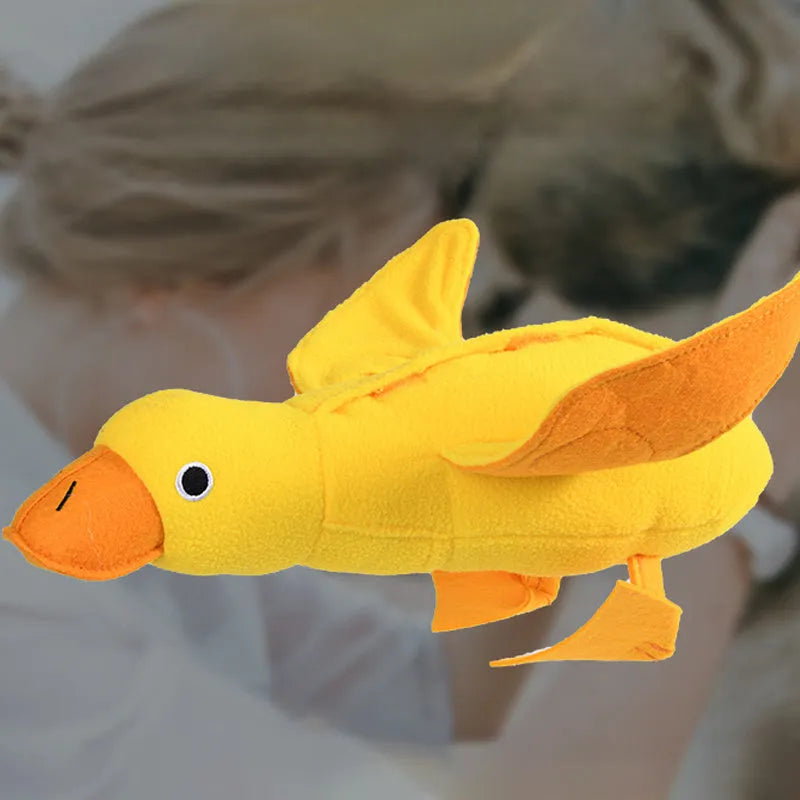 Yellow plush duck dog toy with treat compartments and squeaker for training