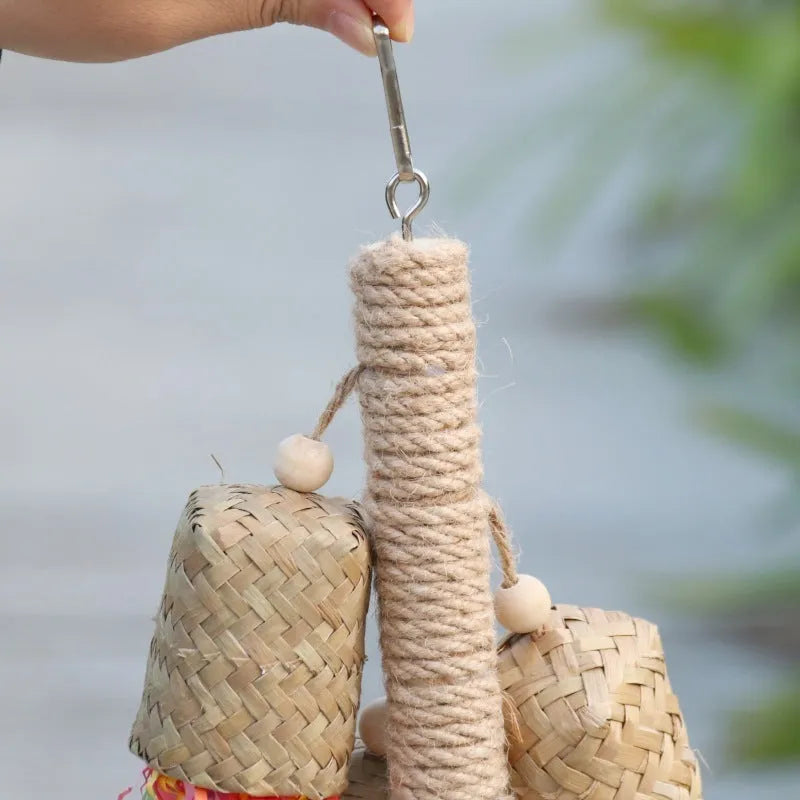 Wood and sisal shredded paper hanging toy for parrots measuring 15 by 35 centimetres