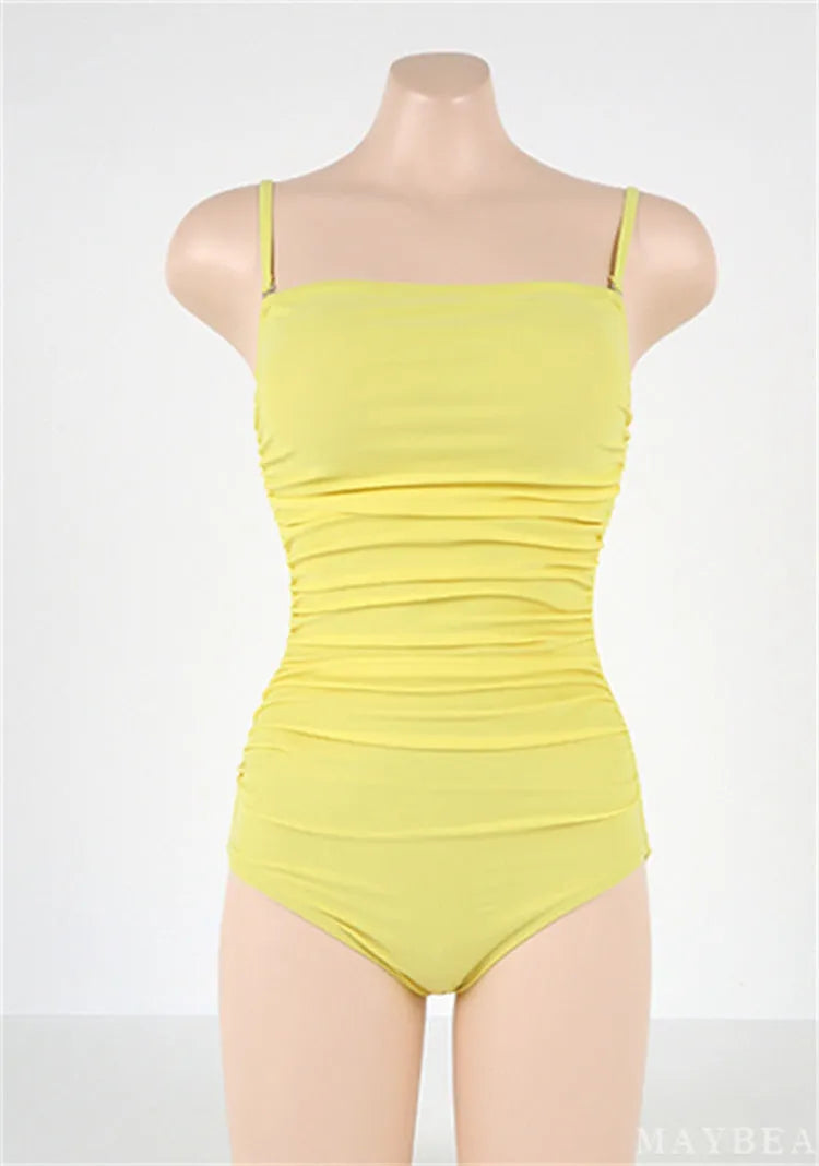 Women's sling style one-piece swimsuit with belly pleats in solid colour options