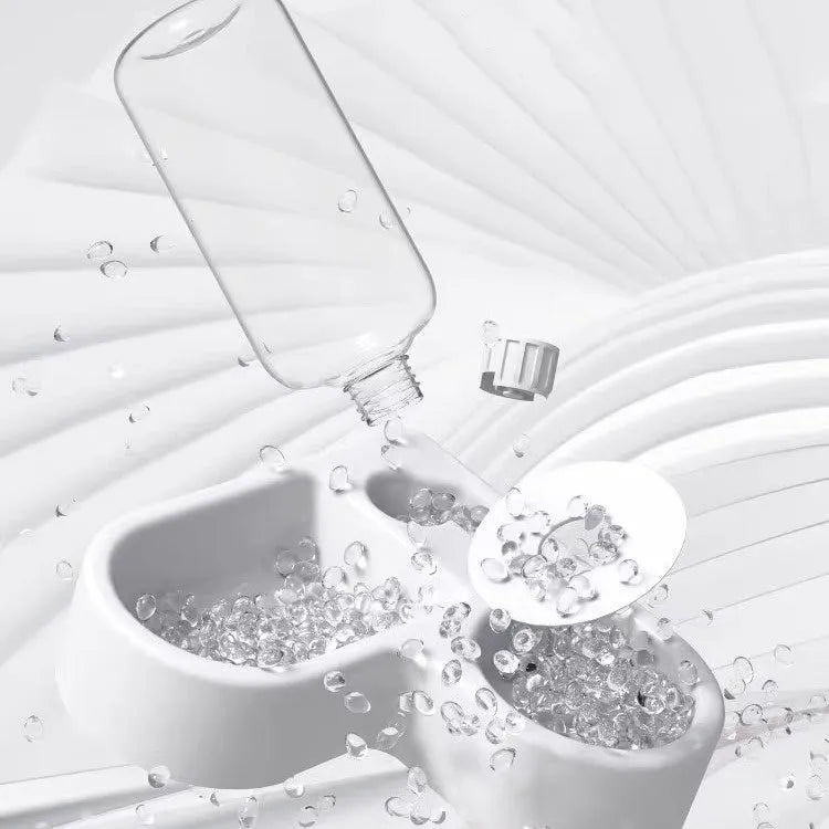 White indoor pet water fountain for cats and dogs on a kitchen floor