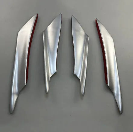 Set of four carbon fibre effect ABS plastic bumper air knife spoilers for car styling.