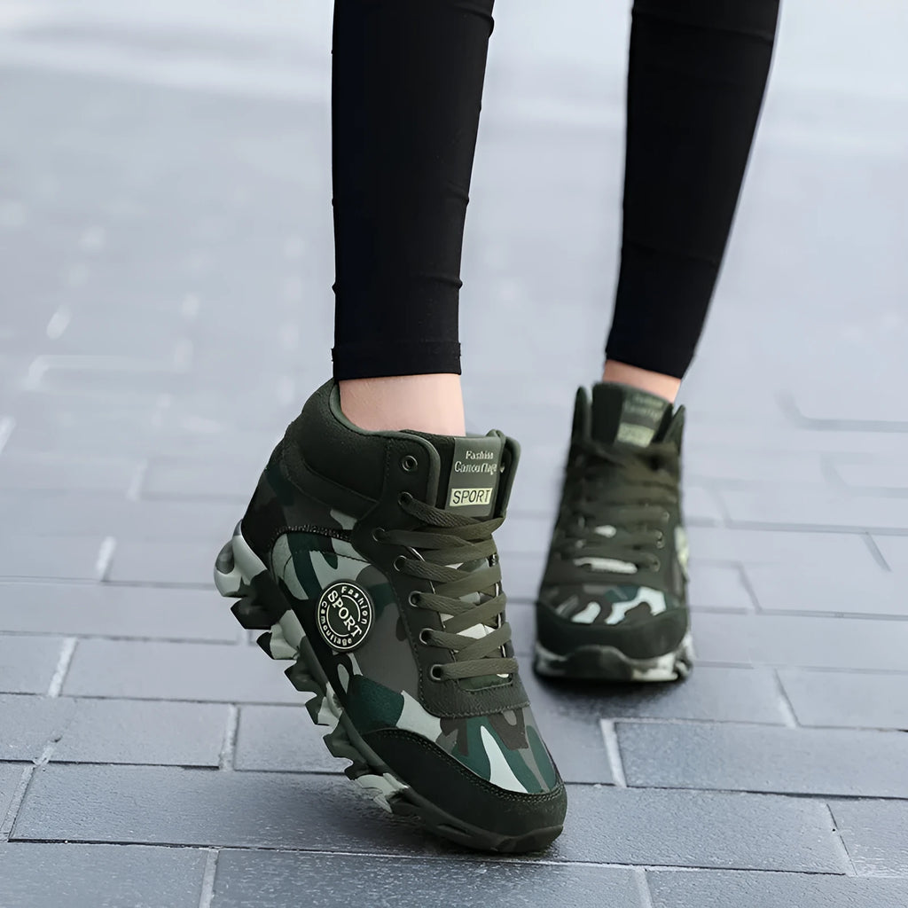 Green women's camouflage canvas sneakers with rubber soles shown in casual style