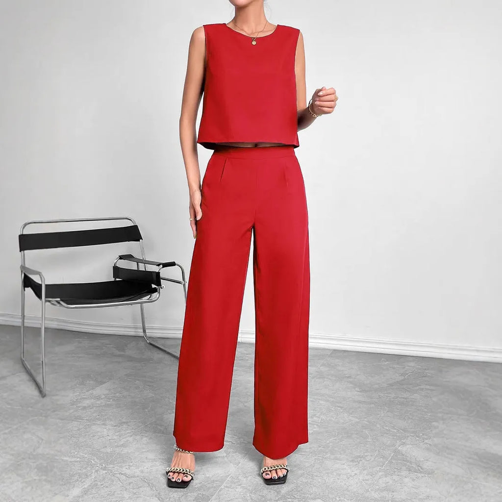 Red sleeveless top and wide leg trousers two-piece set for women on a hanger.