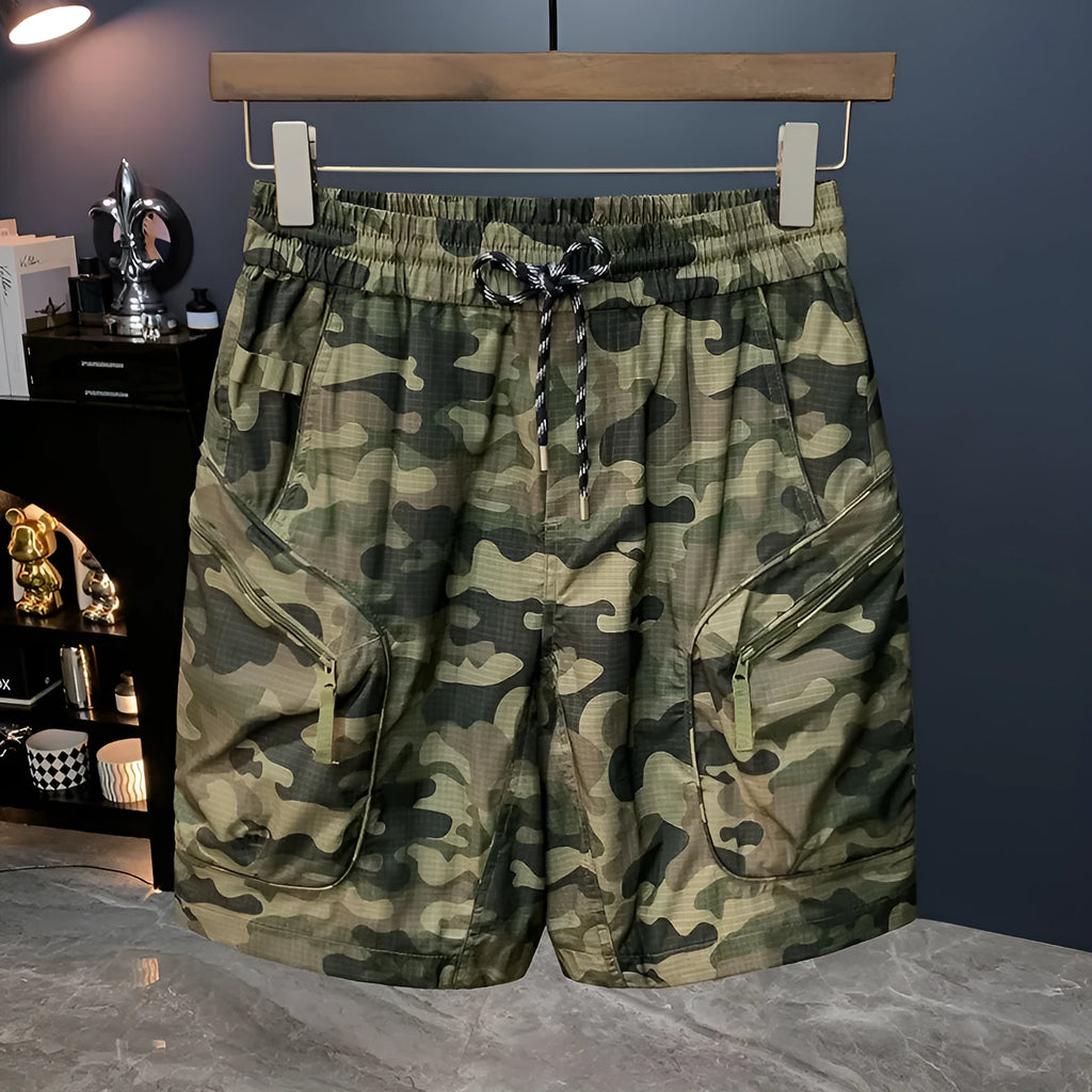Men's camouflage cargo shorts in a loose fit with multiple pockets, shown in camouflage pattern.