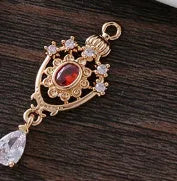 Water drop pendant with zircon crown detail in copper with electroplated finish.