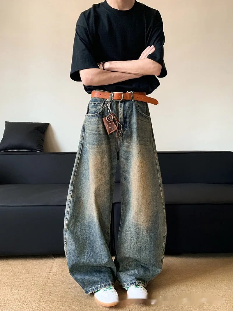 Men's retro blue distressed denim wide-leg jeans with a slimming fit and zip fly