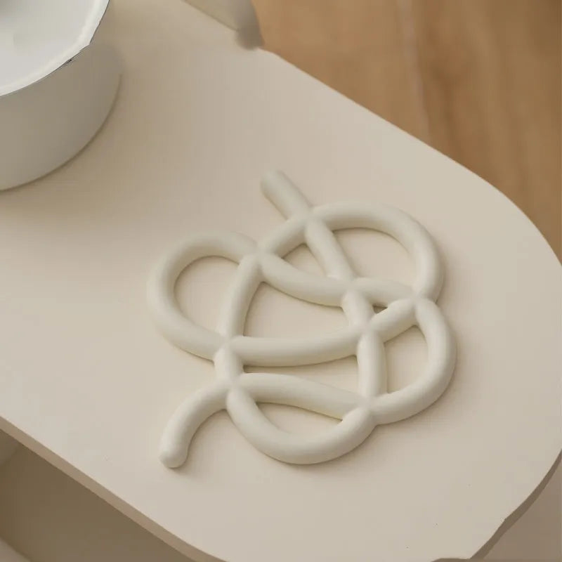 Ceramic heat proof mat in modern minimalist design with irregular shape