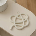 Ceramic heat proof mat in modern minimalist design with irregular shape