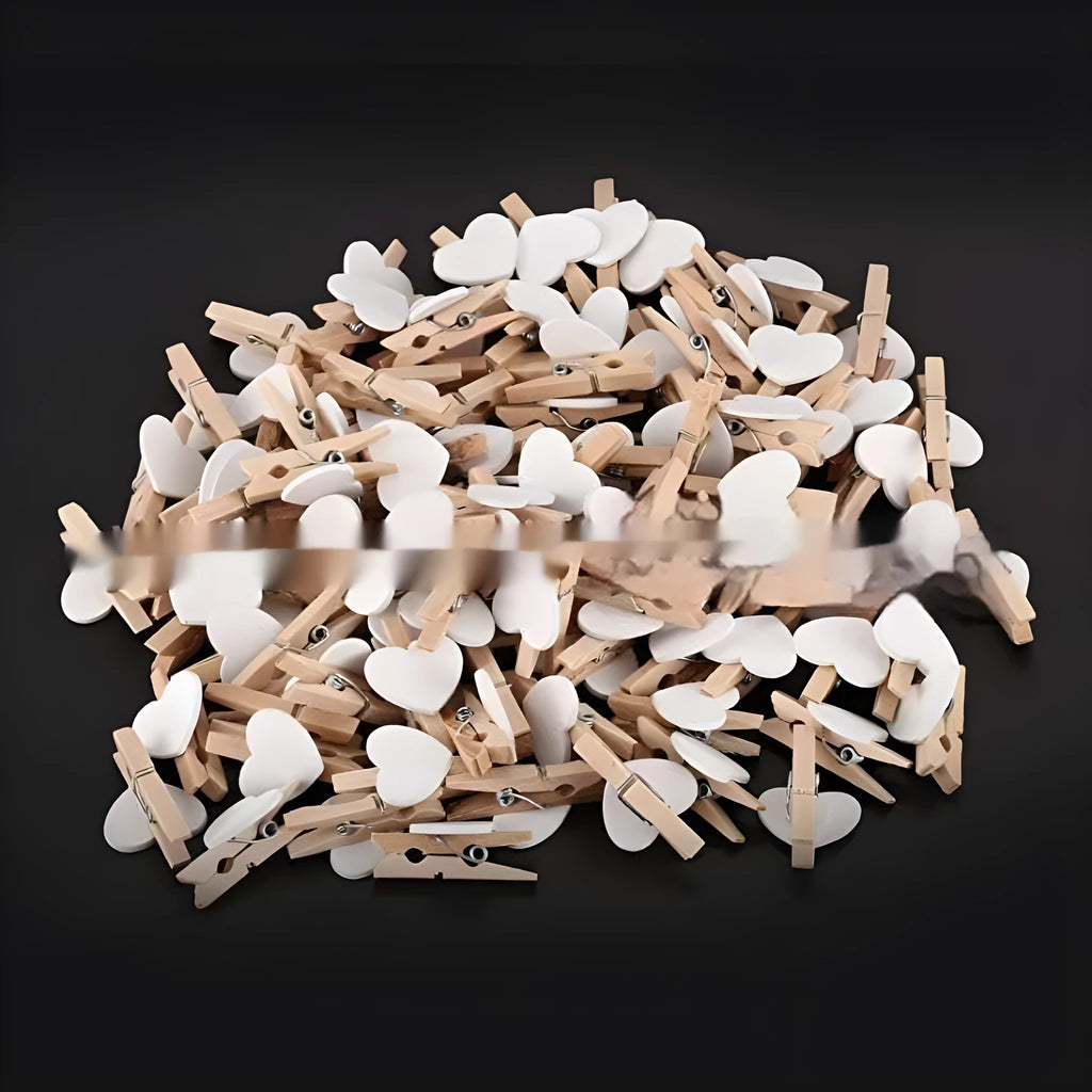 Pack of five solid wood heart-shaped clips in assorted colours on a white background.
