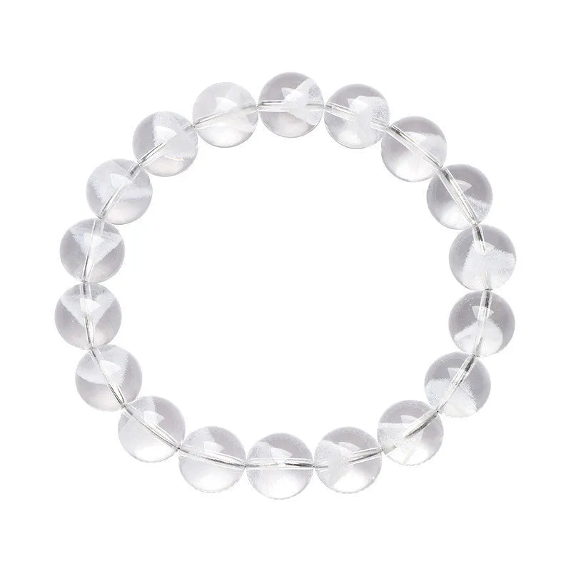 White crystal pyramid bracelet with natural ghost charm and Ruyi symbol detail on wrist