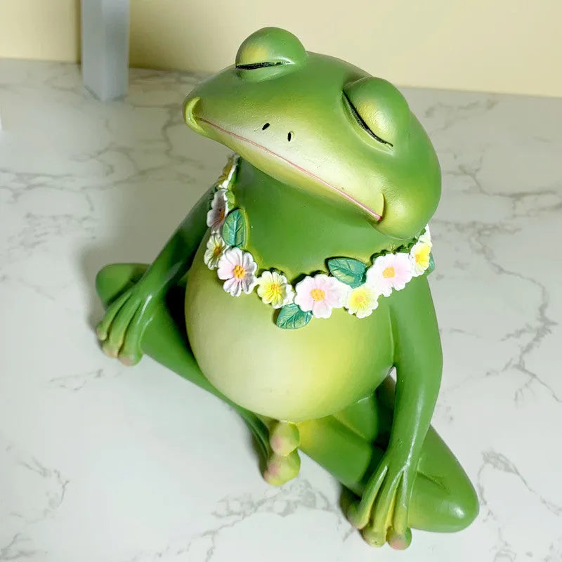 Magic Yoga Frog plastic and resin home ornament in RDW123 colour on a shelf.