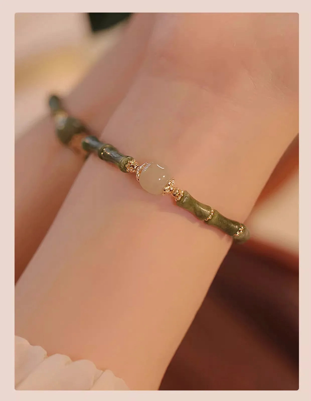 A geometric beaded bracelet made from dark green Hetian jade for women, showing a simple round style.