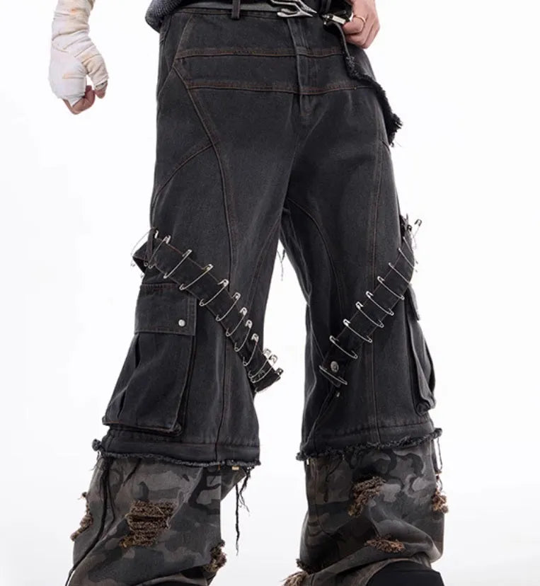 Men's grey camouflage print jeans with splicing panel construction and ribbon detail.
