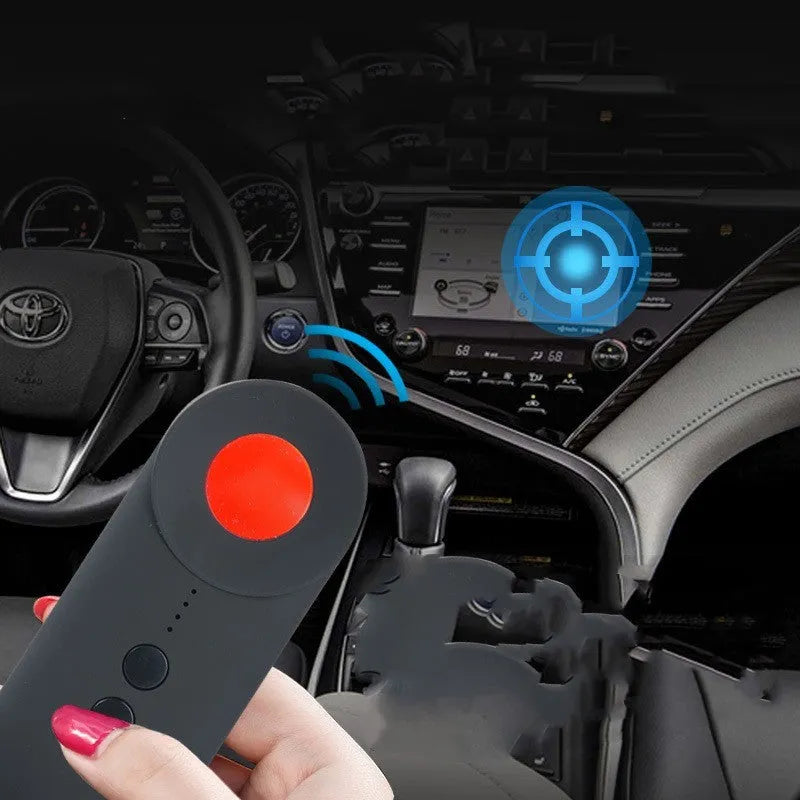 Black handheld GPS and camera detector with display, measuring 93.8mm long, shown with a USB charging cable.