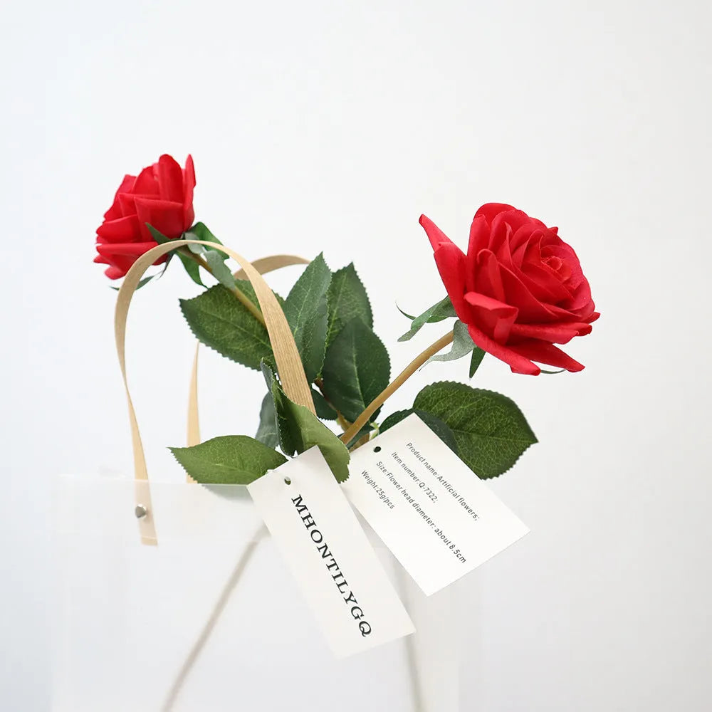 Artificial silk rose bouquet with red fabric flower head and green plastic stem