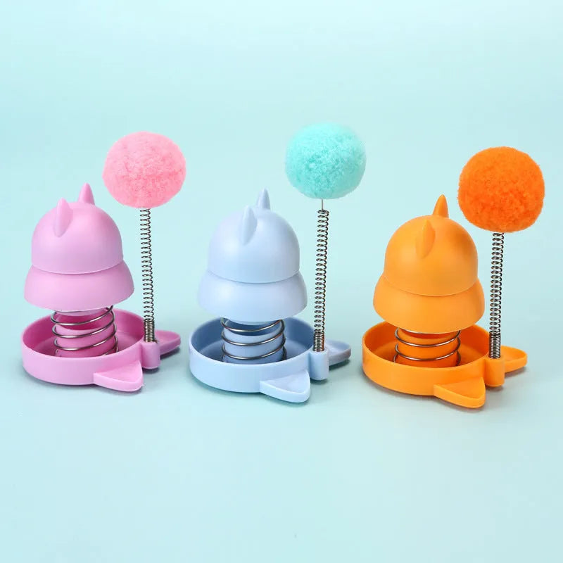 Lucky cat licking mint ball cat toy in blue, orange, and pink colours measuring 55mm diameter