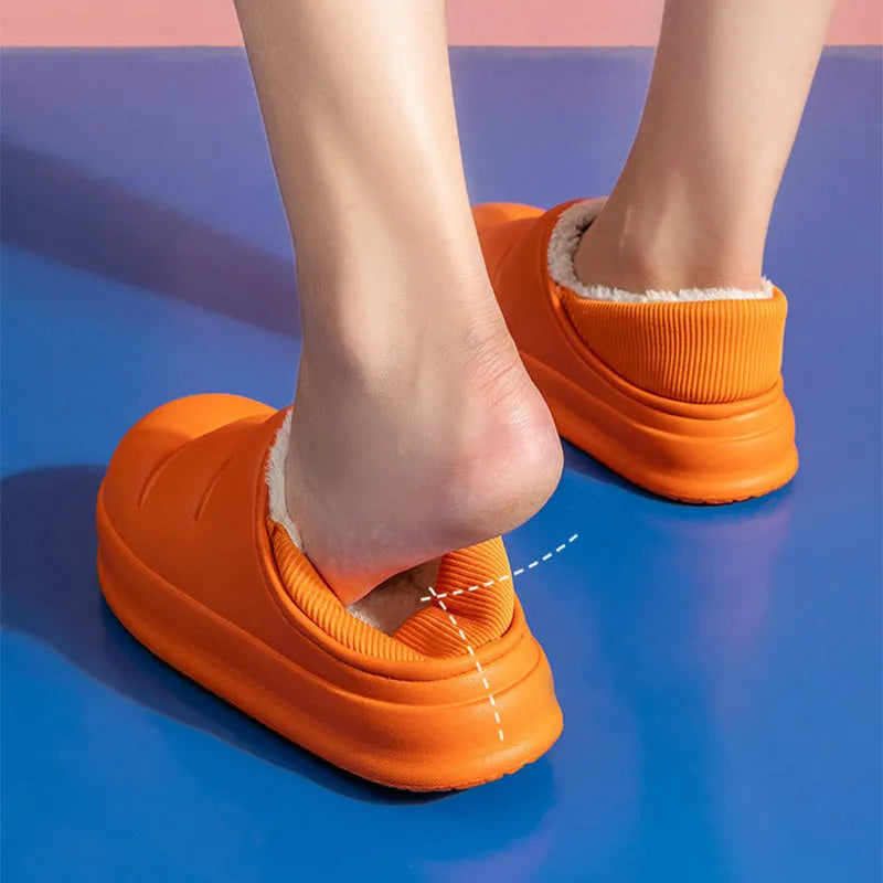 Waterproof EVA winter slippers with plush lining in multiple colours showing non-slip soles