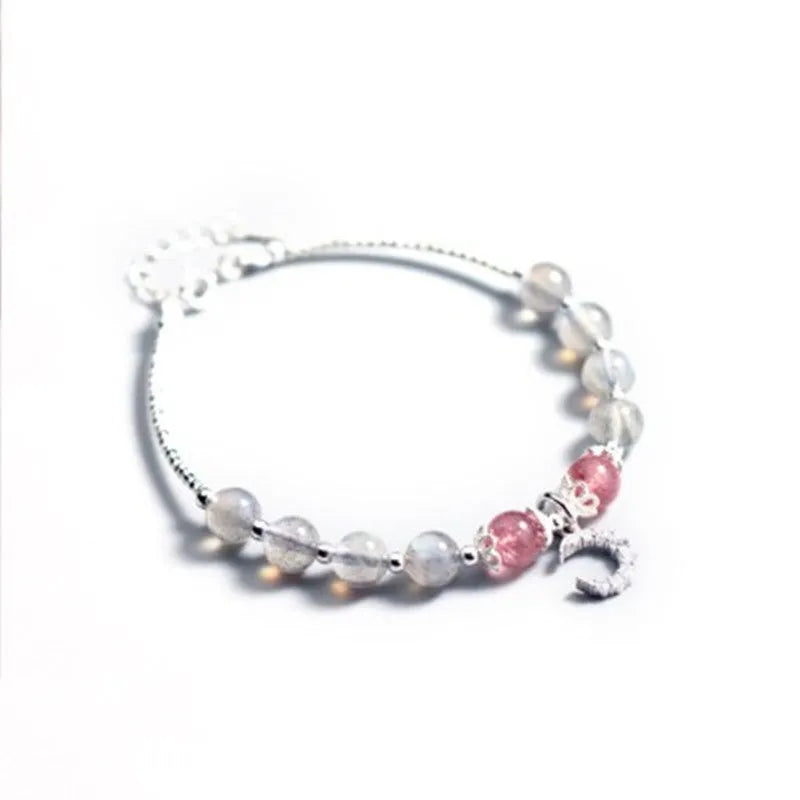 Handmade silver-tone adjustable bracelet with a 6mm moonstone bead and a small crescent moon charm.