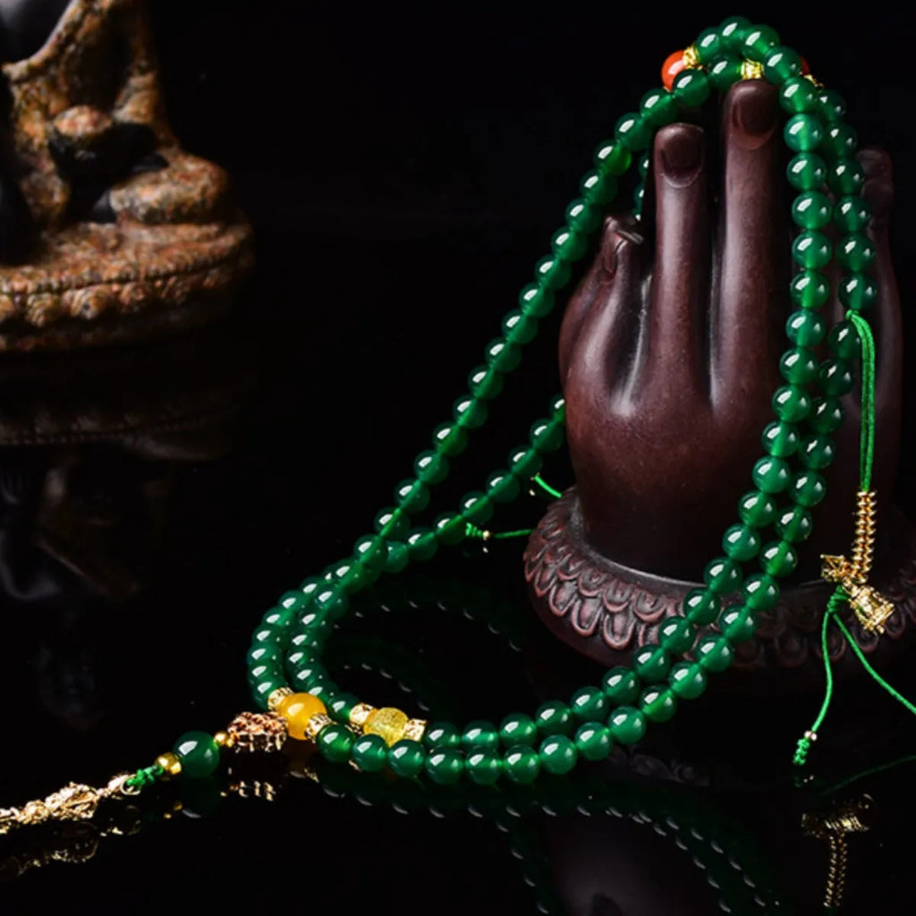 Handmade green agate multi-strand bracelet for men and women on a white background.