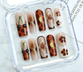 Pack of French style and cute design nail art stickers with jelly glue and rubbing strip in three sizes: S, M, and L code.
