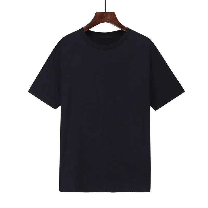 Men's loose-fit cotton t-shirt in black, shown on a model, with short sleeves.