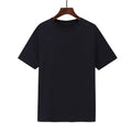 Men's loose-fit cotton t-shirt in black, shown on a model, with short sleeves.