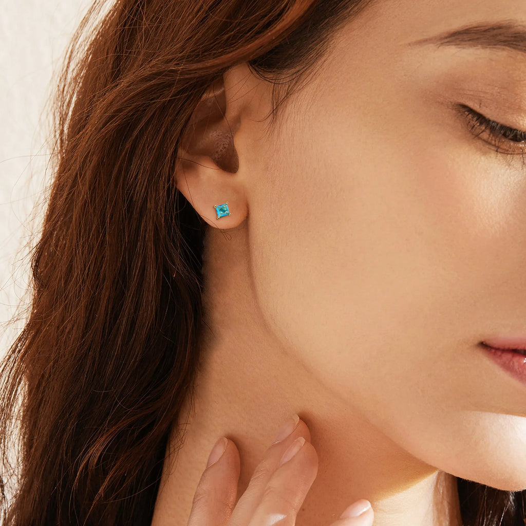 Brass gold-plated drop-shaped zircon earrings with pear silhouette on copper base