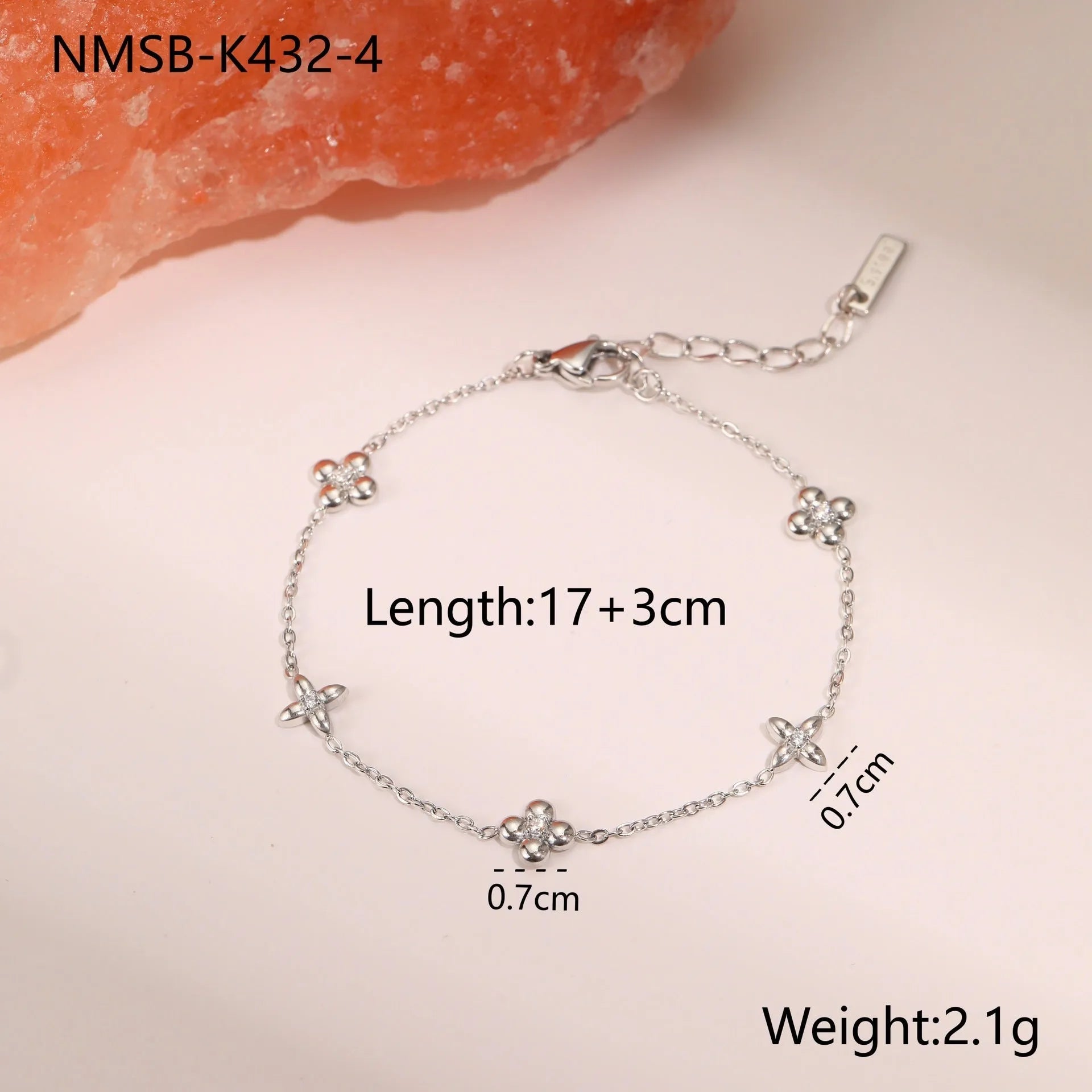 Stainless steel women's bracelet with geometric star pendant featuring hexagonal elements and gold plating