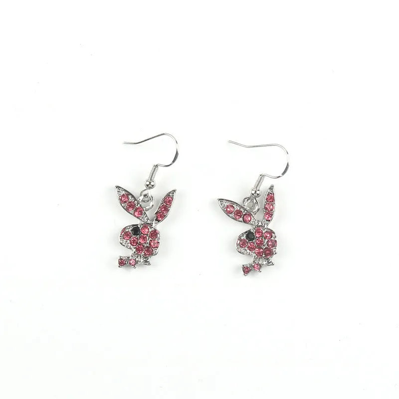 Silver, pink, and gold alloy stud earrings with a full diamond cartoon rabbit design.