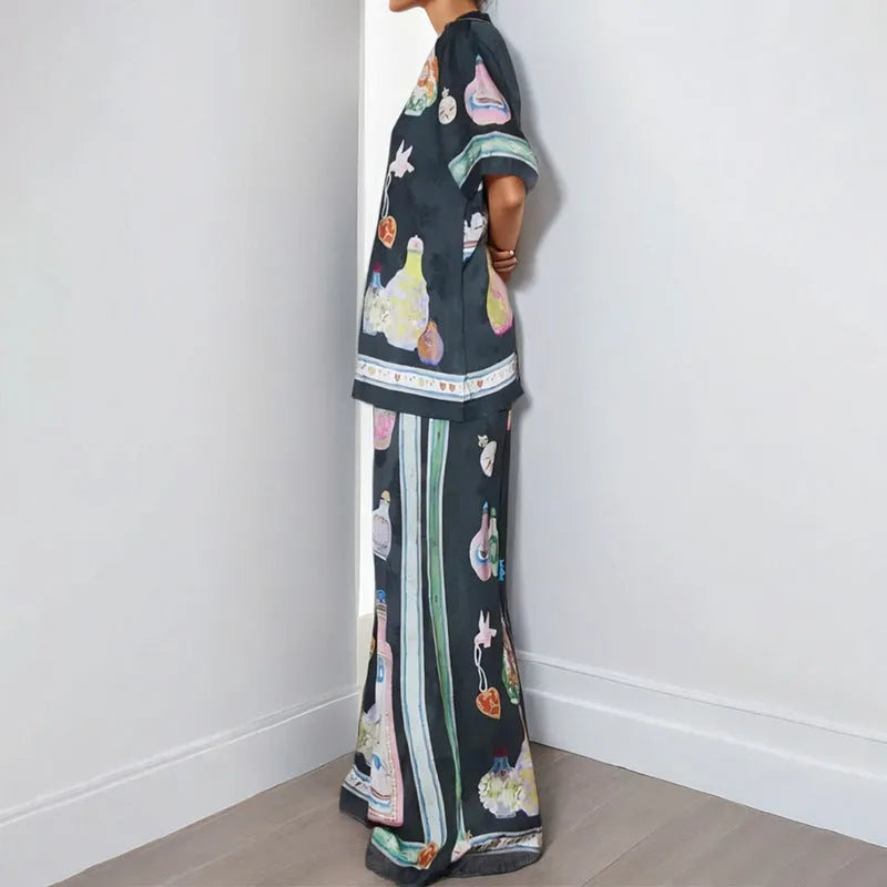Black women's casual set with cartoon pattern featuring cardigan-sleeve top and matching trousers