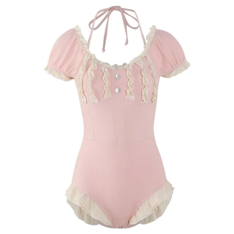 Pink women's conservative one-piece swimsuit with Siamese cute design on mannequin