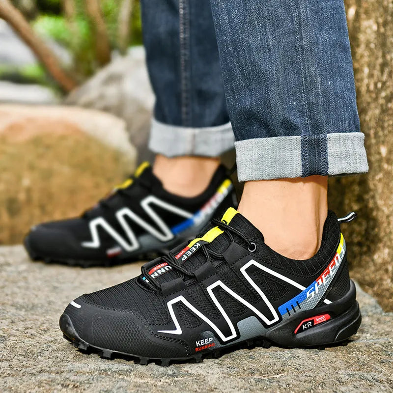 Men's gray orange casual running shoe with synthetic leather upper and low-top design.