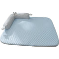 Blue polyester pet bed cushion with printed big-eyed monster face design, shown on a wooden floor.