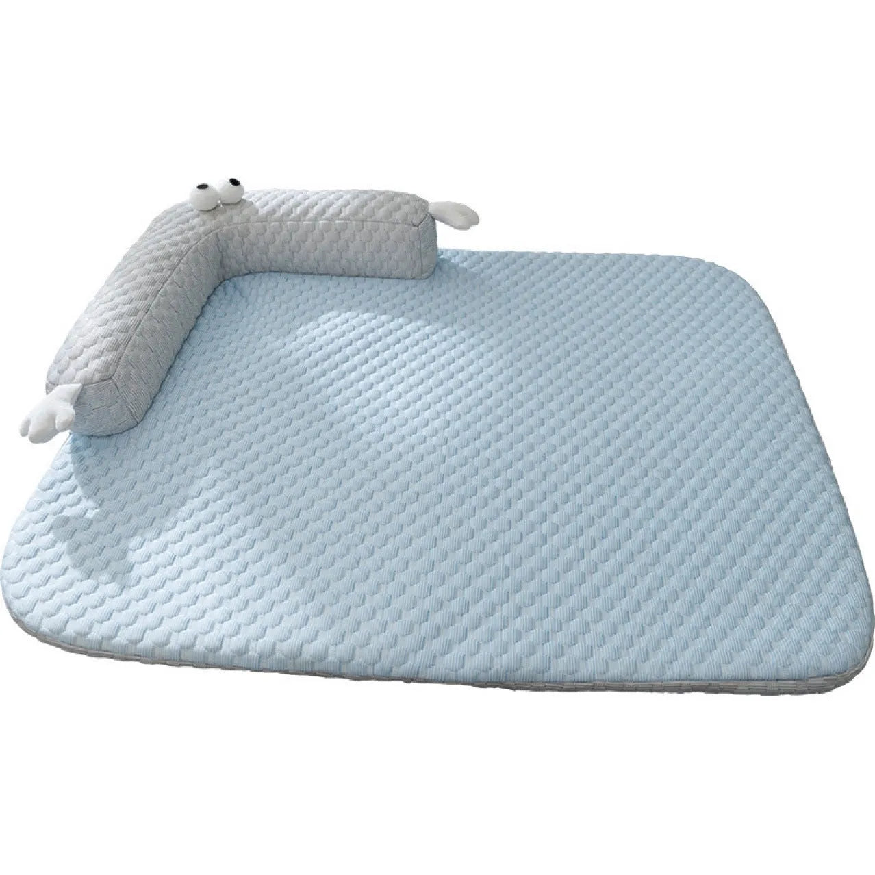 Blue polyester pet bed cushion with printed big-eyed monster face design, shown on a wooden floor.