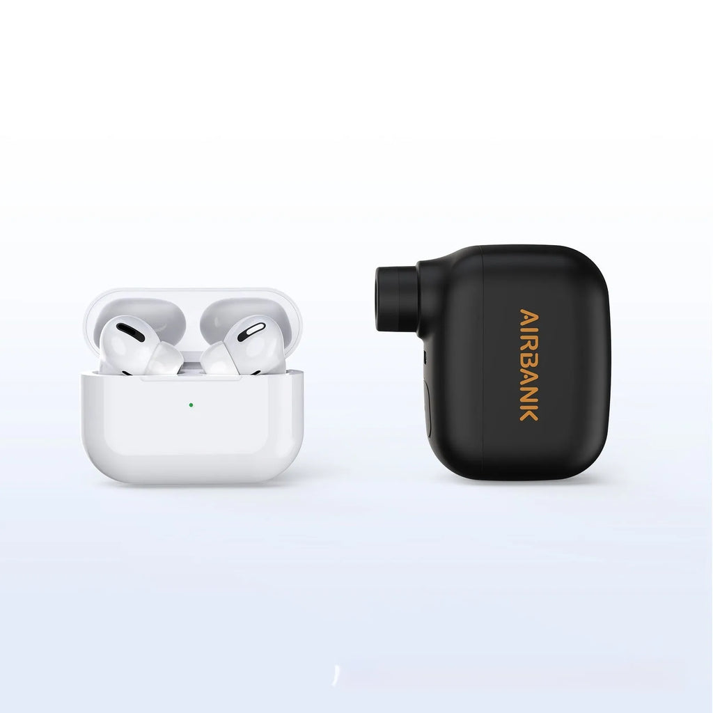 Black AS100 electric bike pump with USB cable and waterproof bag on a white background.
