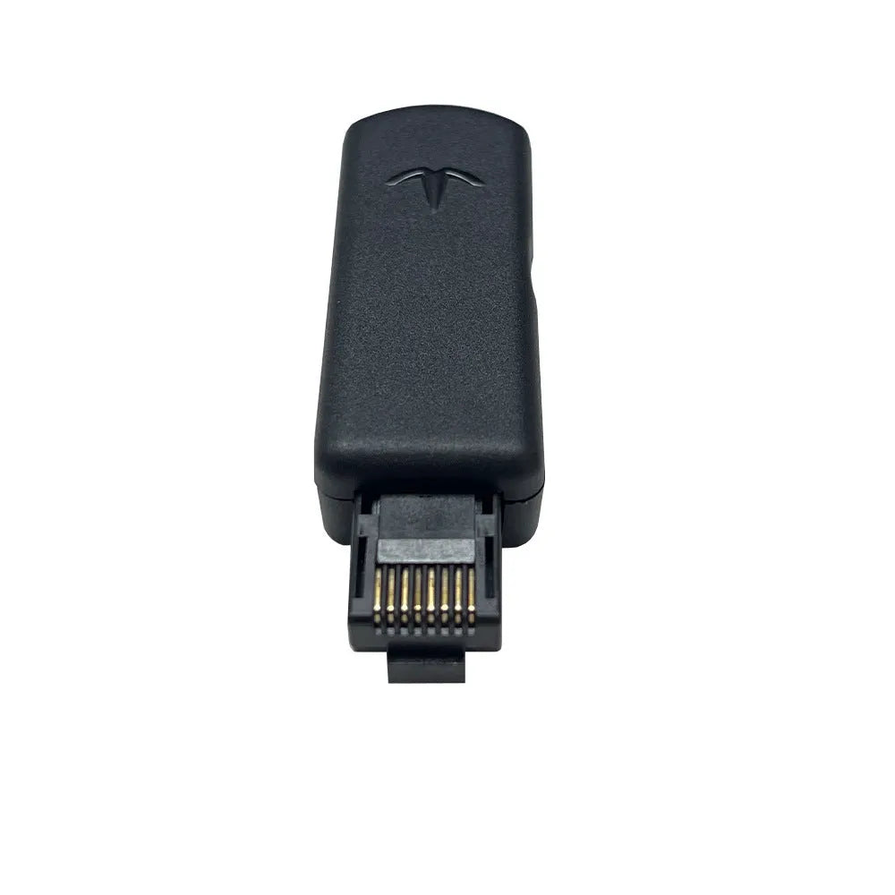 Black JB Tool USB gaming adapter with alloy construction next to its data cable and user manual.