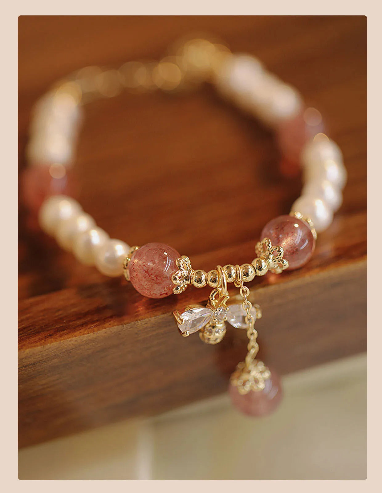 Crystal bracelet with strawberry quartz stringed pearls and bow detail for female summer wear