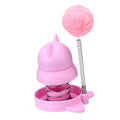Lucky cat licking mint ball cat toy in blue, orange, and pink colours measuring 55mm diameter
