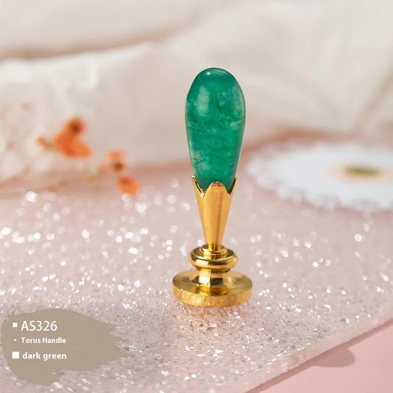 Wooden wax seal handle in a selection of different colour and decorative finishes.