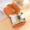 Gold green square ladies watch with four matching bracelets in five-piece jewellery set