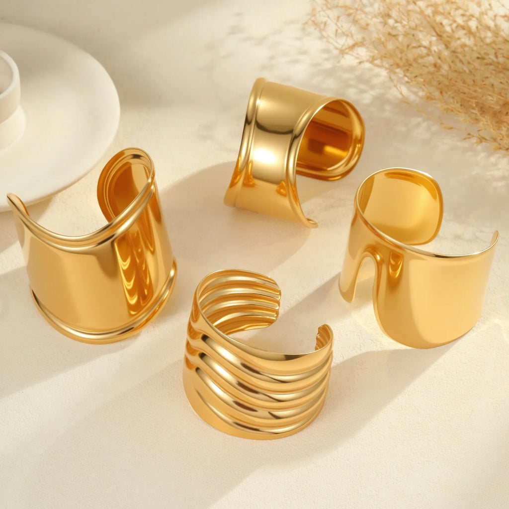 Women's exaggerated wide stainless steel bracelet with 18K gold plating and geometric wave design
