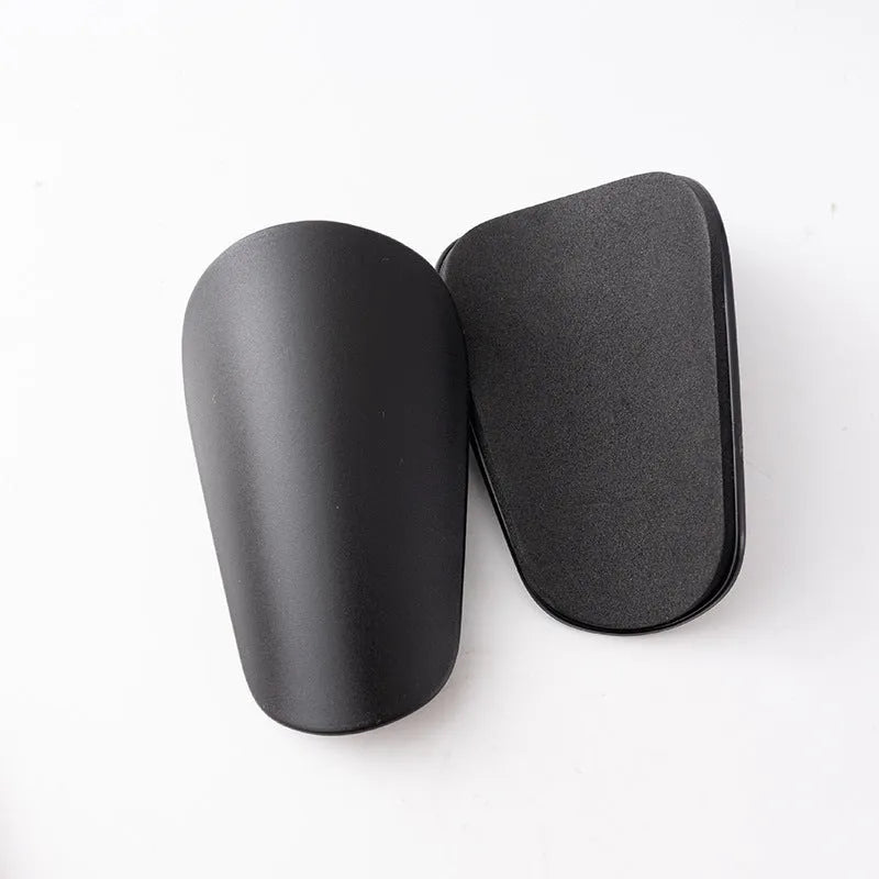 PU mini shin guards for football and sports protection in black, white, red and blue colours